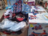 a box full of children ' s clothing and toys in a garage