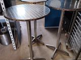 two tables that are sitting next to each other in a room