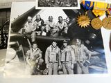 a picture of a group of men standing in front of a plane