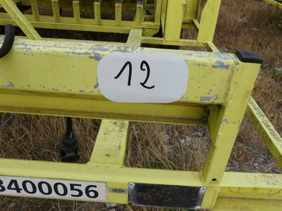a close up of a yellow forklift with a number on it
