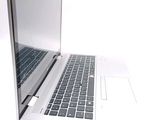 a close up of a laptop computer on a white surface