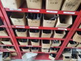 many boxes and bins of assorted items on the shelves