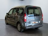 a silver van that is parked in a room