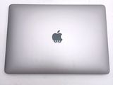 a laptop with an apple logo on the back of it
