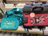 a pile of luggage sitting on a table in a store