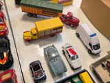 a lot of toy cars and trucks on the table