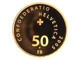 une pièce d'or sur laquelle est gravée une croix