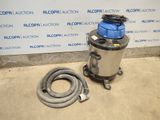 an image of a vacuum and a hose on the floor