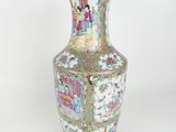 a vase that is sitting on a white surface