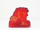 a red statue of a man with a crown on it ' s head