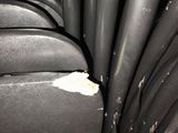 a bunch of black leather chairs that are in a room