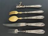 six pieces of silverware including a fork, knife, and spoon