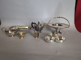 a lot of silver items that are on a table