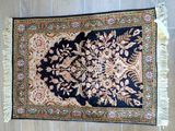 an oriental rug on a wooden floor with a wooden floor