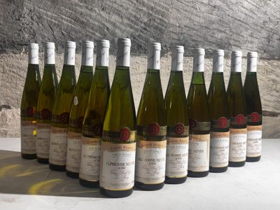 several bottles of wine are lined up in a row on a table