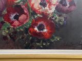 a painting of red and white flowers in a gold frame