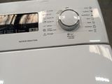 a washing machine that is sitting on the floor