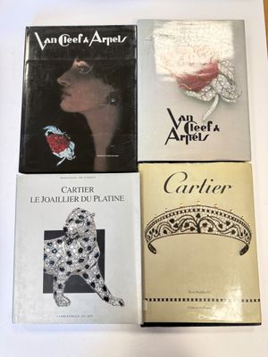 three books are sitting on a table next to a pair of scissors