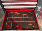 a tool drawer with tools in it in the garage