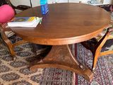 a wooden table with a book on it in a living room