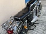 a motorcycle that is parked on the side of the street