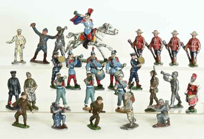 a lot of figurines that are on a white surface