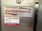 an image of a refrigerator in a kitchen with a sticker on the door