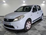 a picture of a small white car parked on a checkered floor