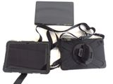 a camera and a tablet on a white surface