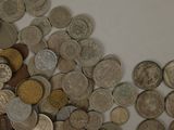 a lot of coins that are on the table