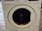 a washing machine that is sitting on the floor