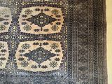 an image of a rug with a pattern on it on a wall