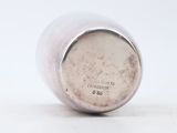 an image of a close up of a silver cup on a white surface