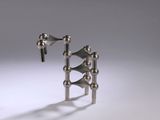 a metal object that is sitting on a white surface