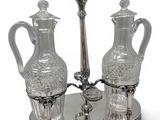 a silver tray with two glass vases on it