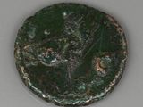 a close up of a green coin with a tree on it