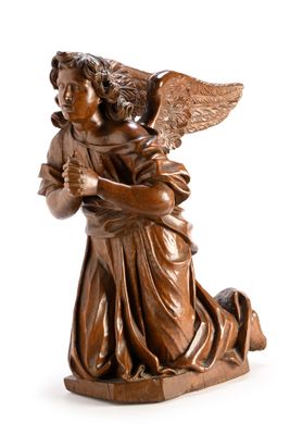 une image représentant une statue d'un ange tenant un bébé dans ses bras