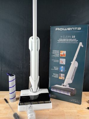 a box with a vacuum on a table next to a box of cleaning supplies