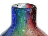 a colorful glass vase that is sitting on a table
