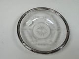 a clear glass bowl with a star design on it