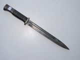 a picture of a knife on a white surface
