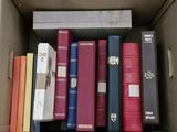 a box full of books that are sitting on a shelf