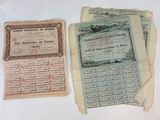 some old papers are sitting on top of a white table