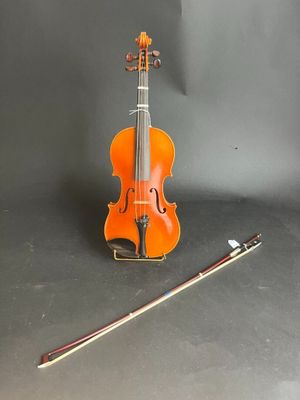 a violin and a violin stick on a table