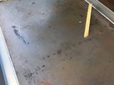 a metal door that is open on the outside of a building
