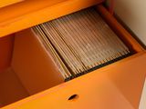 a file cabinet with a drawer full of file folders