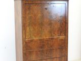 a wooden cabinet with a marble top on wheels
