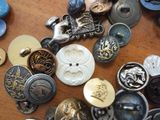 a lot of buttons that are on a table