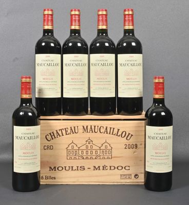 six bottles of red wine in a wooden crate on a table