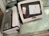 two microwaves and a toaster sitting on a counter